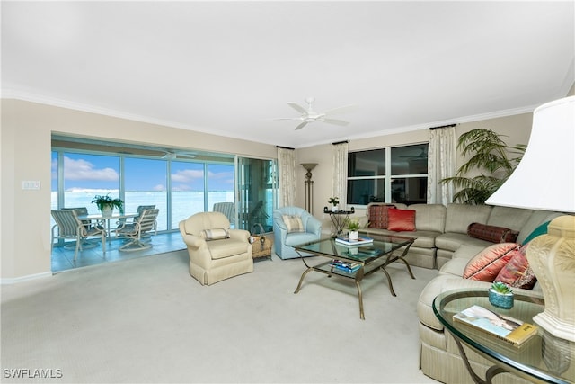 living room featuring carpet flooring, ceiling fan, a water view, and ornamental molding