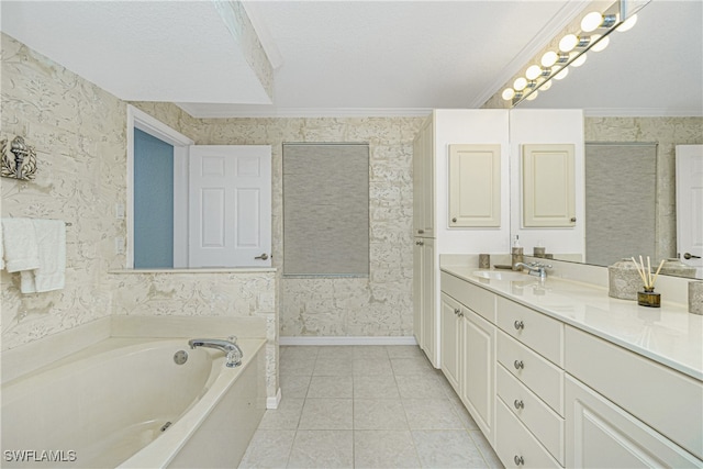 bathroom featuring vanity, a bathtub, tile patterned floors, crown molding, and a textured ceiling