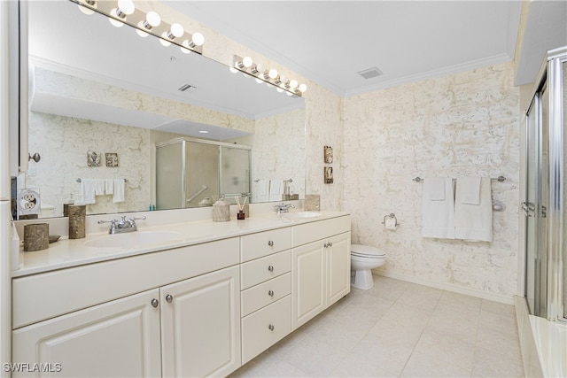 bathroom featuring vanity, toilet, crown molding, and walk in shower