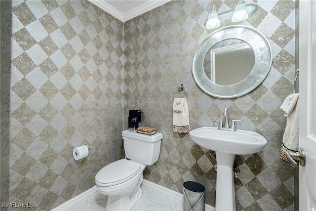 bathroom with crown molding and toilet