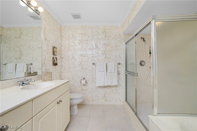 bathroom featuring walk in shower, vanity, crown molding, tile patterned flooring, and toilet