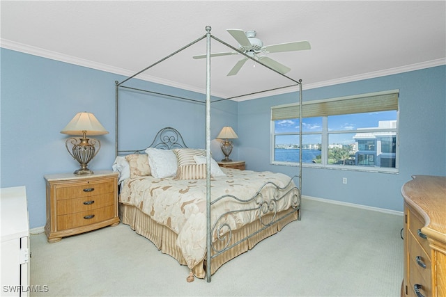 bedroom featuring ceiling fan, light colored carpet, and ornamental molding