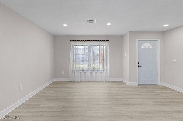 entryway with light hardwood / wood-style floors