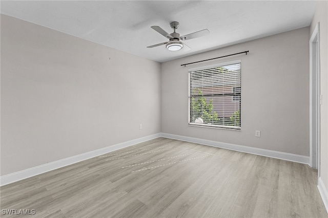 unfurnished room with light wood-type flooring and ceiling fan