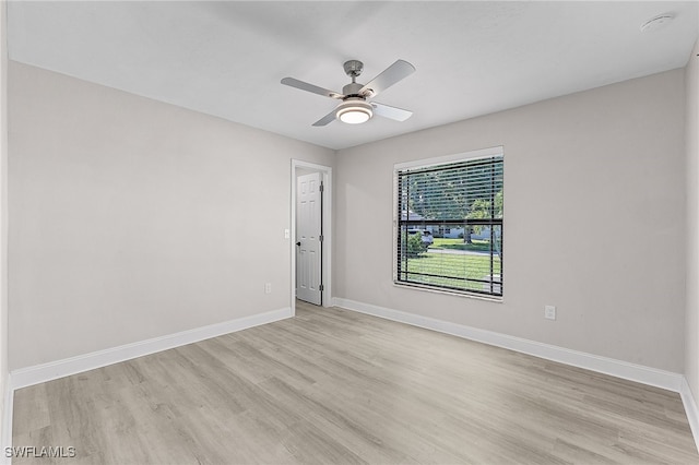 spare room featuring ceiling fan and light hardwood / wood-style floors