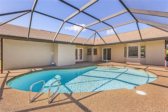 view of pool featuring a patio area, a lanai, and french doors