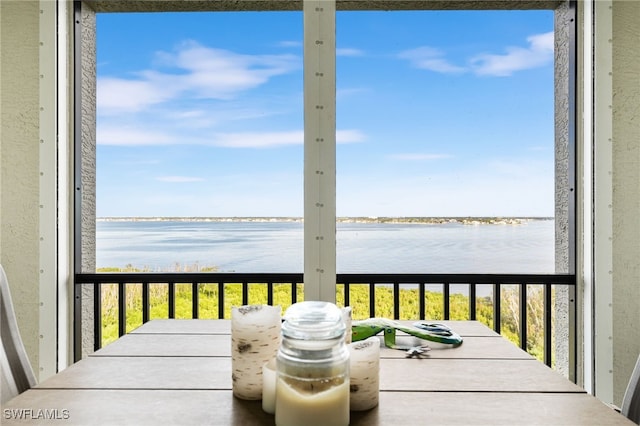 balcony featuring a water view