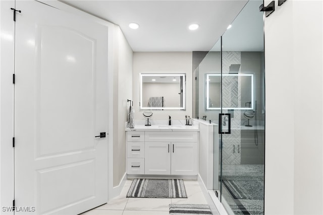 bathroom with vanity and a shower with door