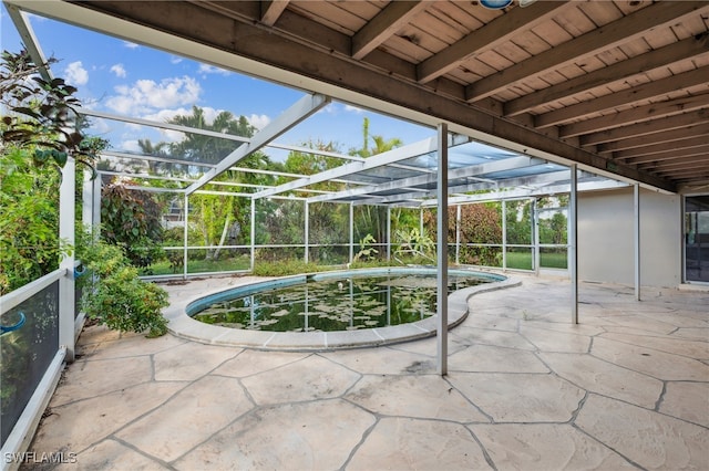 view of patio with a lanai