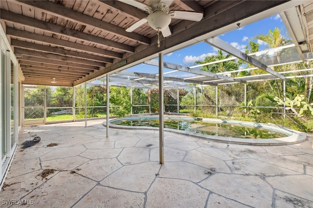 view of patio / terrace with ceiling fan and a lanai