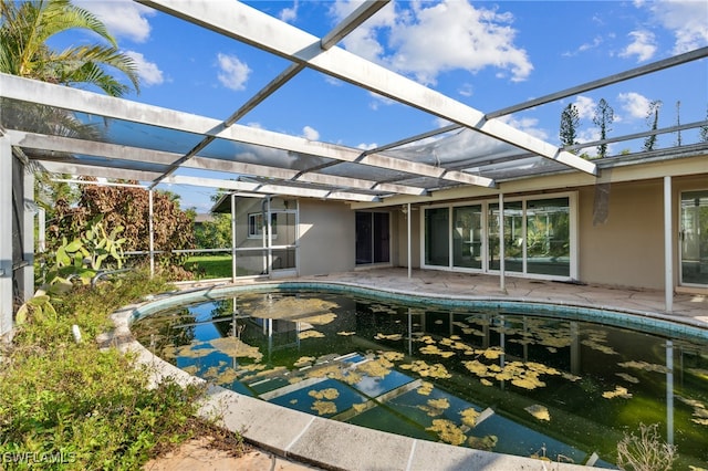 view of pool featuring a lanai and a patio