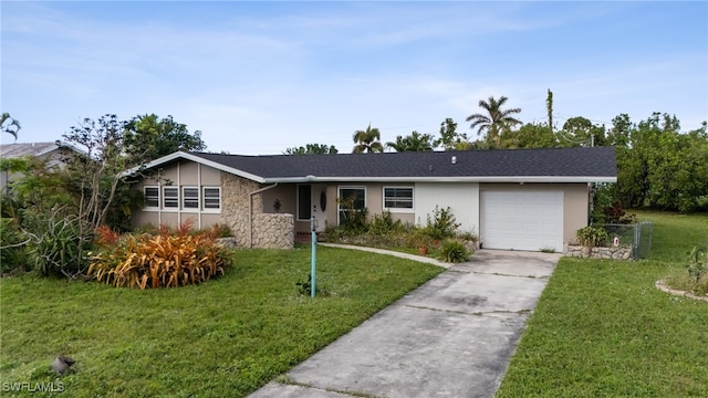 ranch-style home with a front yard and a garage