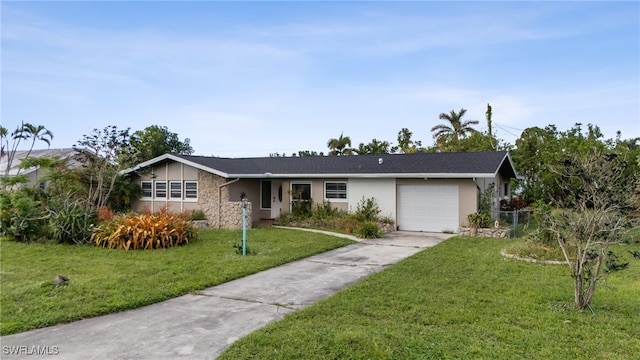 ranch-style home with a garage and a front yard