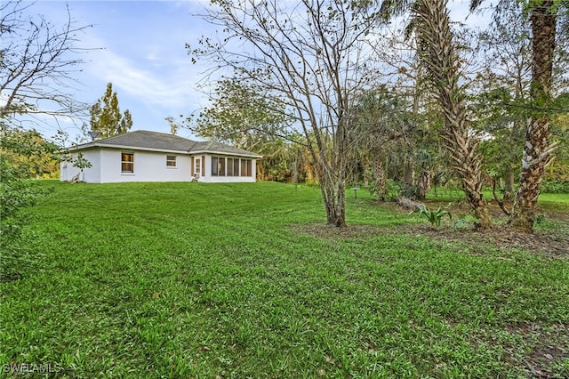 view of yard featuring a sunroom