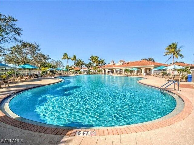 view of swimming pool with a patio