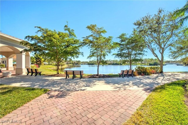 surrounding community with a water view