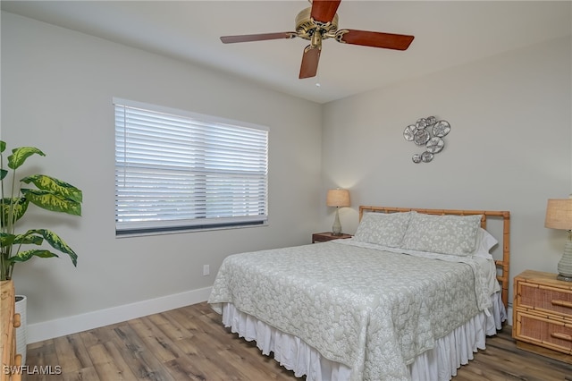 bedroom featuring ceiling fan and wood-type flooring