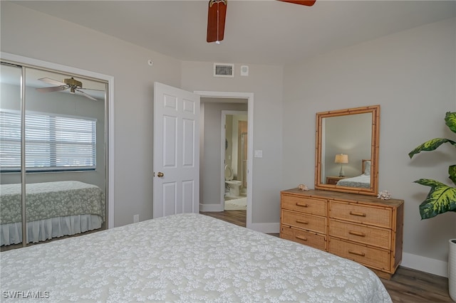 bedroom with ceiling fan, a closet, ensuite bathroom, and dark hardwood / wood-style floors