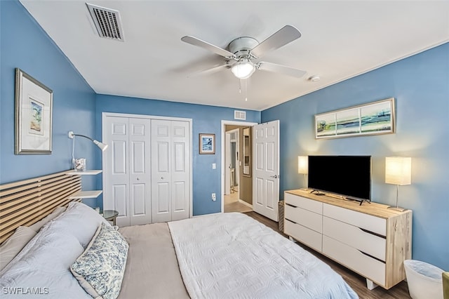 bedroom with ceiling fan, a closet, and wood-type flooring