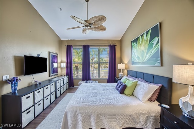 bedroom with ceiling fan, dark hardwood / wood-style flooring, and vaulted ceiling