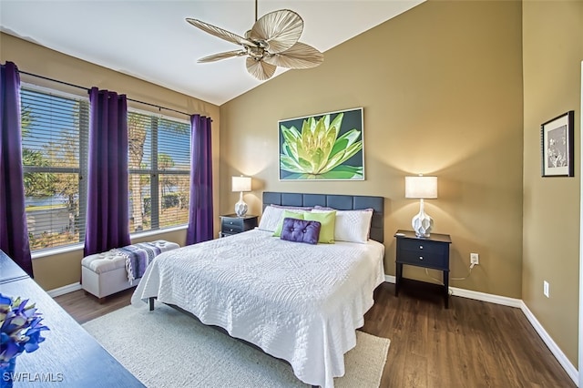 bedroom with dark hardwood / wood-style floors, ceiling fan, and lofted ceiling