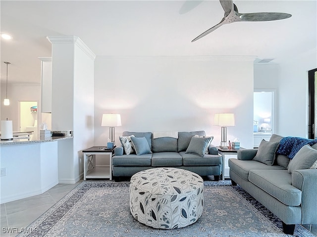 living room featuring ceiling fan and ornamental molding