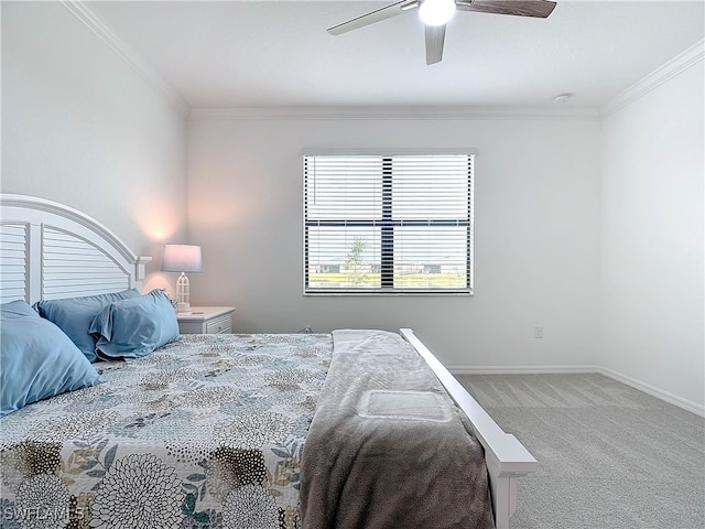 carpeted bedroom with ceiling fan and crown molding