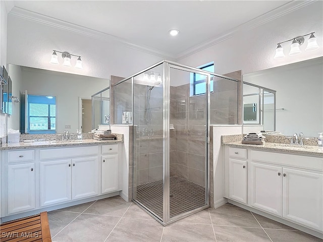 bathroom with tile patterned floors, a shower with shower door, and crown molding