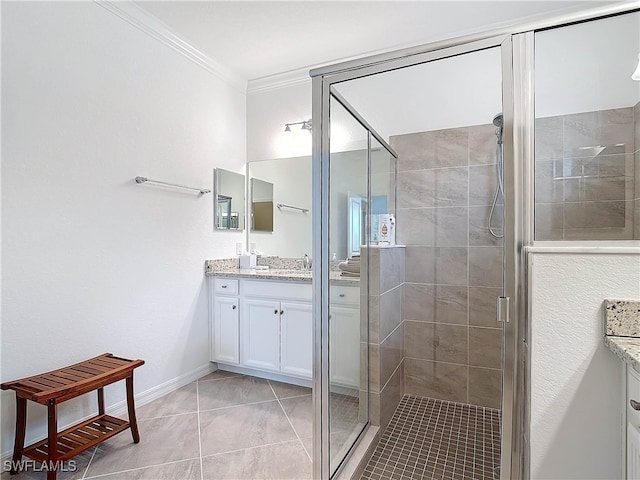 bathroom featuring tile patterned flooring, vanity, crown molding, and walk in shower