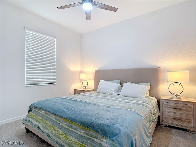 bedroom featuring ceiling fan and light colored carpet