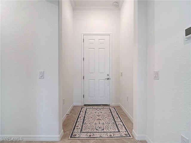 doorway to outside with crown molding and light tile patterned flooring