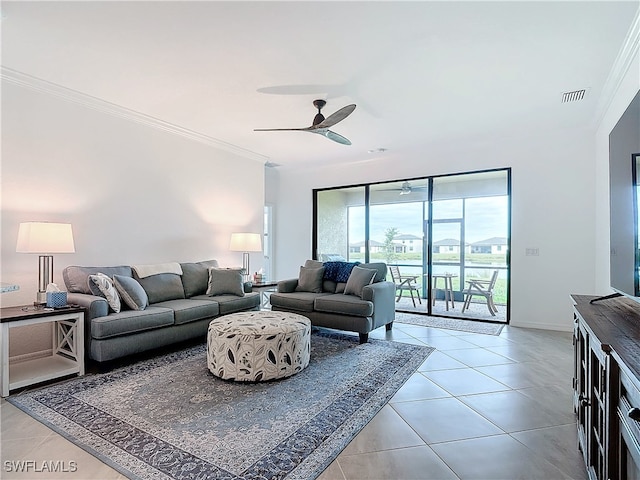 living room with light tile patterned floors, ceiling fan, and ornamental molding