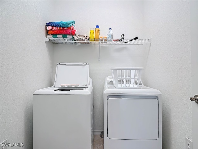 washroom featuring washer and dryer