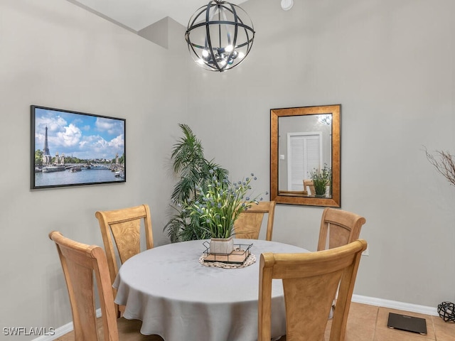 dining area with a notable chandelier and light tile patterned flooring