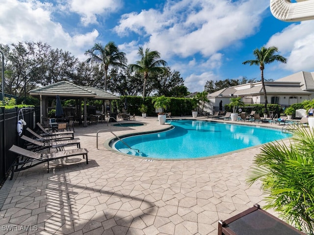 view of swimming pool featuring a gazebo and a patio