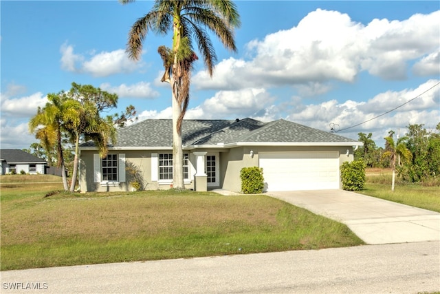 single story home featuring a garage and a front yard