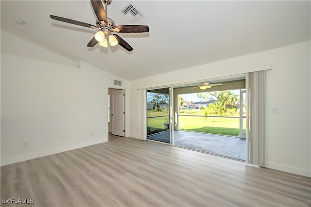 unfurnished room with ceiling fan, light hardwood / wood-style flooring, and lofted ceiling