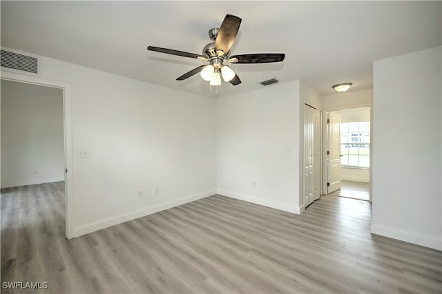 unfurnished room featuring ceiling fan and light hardwood / wood-style floors