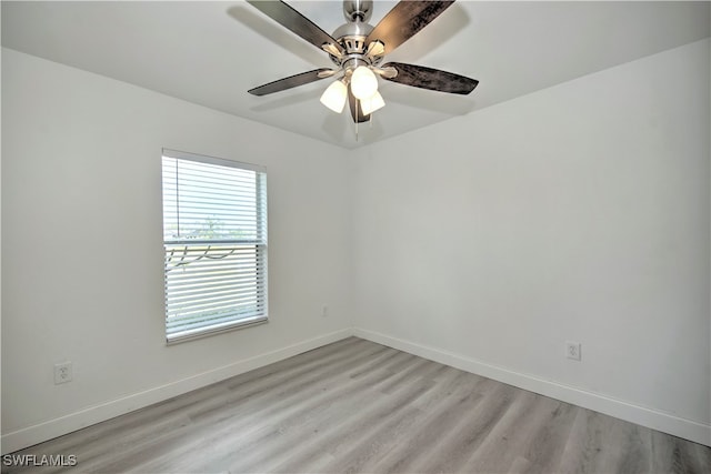 empty room featuring ceiling fan and light wood-type flooring