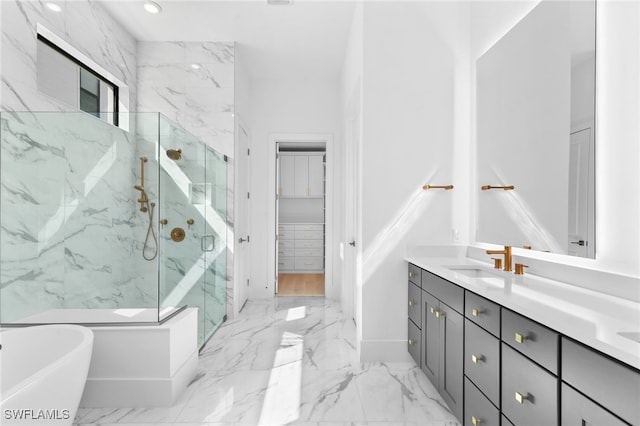 bathroom with vanity and independent shower and bath