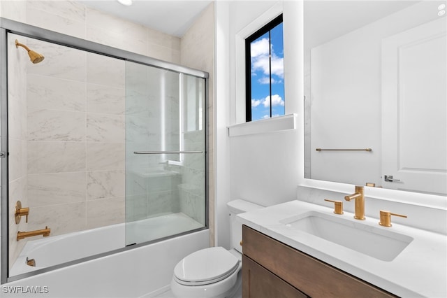 full bathroom featuring vanity, toilet, and enclosed tub / shower combo