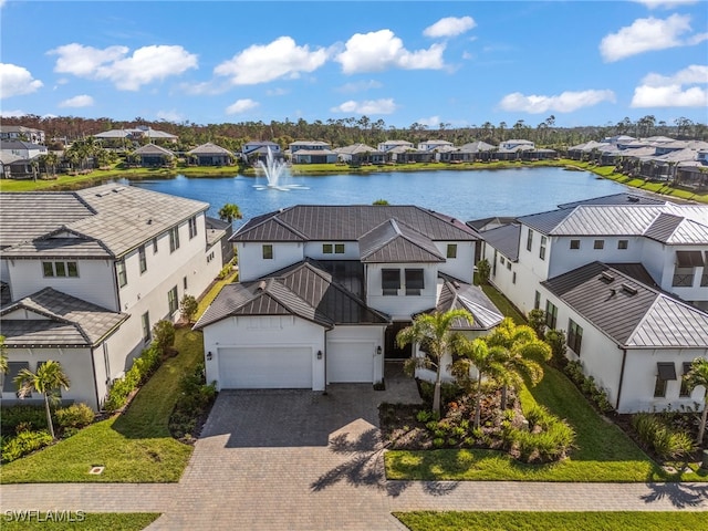 birds eye view of property with a water view