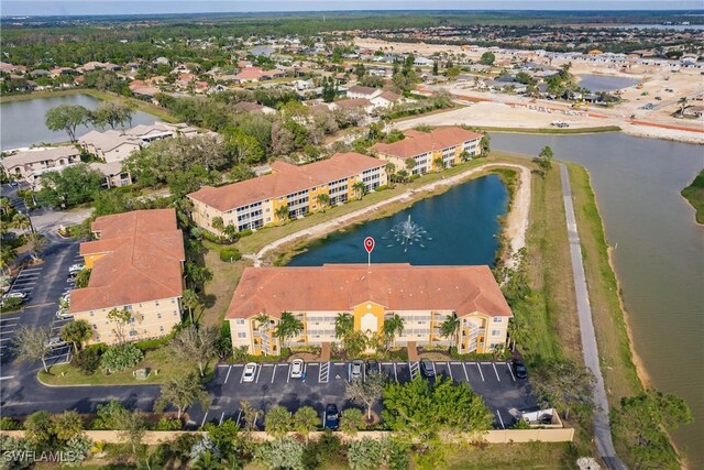 bird's eye view with a water view