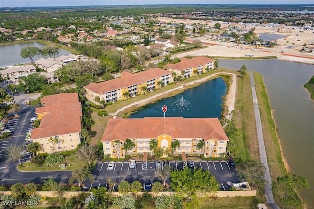 aerial view with a residential view and a water view