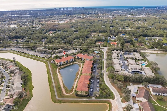 bird's eye view featuring a water view and a residential view