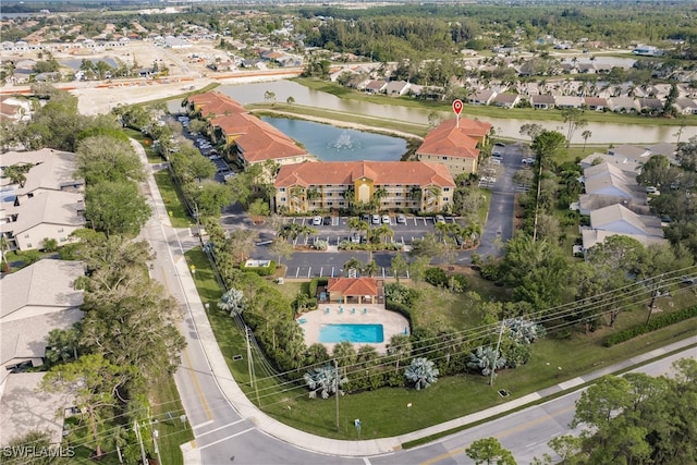 birds eye view of property featuring a water view