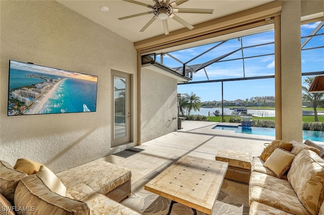 view of patio with a water view, pool water feature, an outdoor living space, and ceiling fan