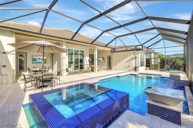 view of swimming pool with an in ground hot tub, a patio, pool water feature, and a lanai