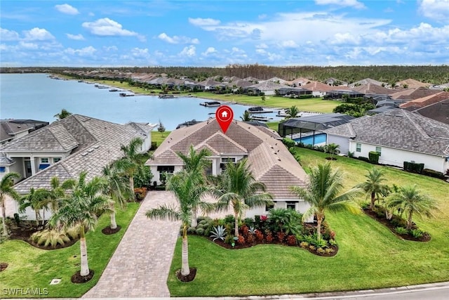 birds eye view of property featuring a water view