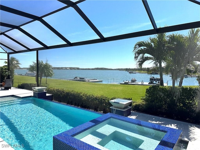 view of swimming pool with a yard, a water view, a lanai, and a patio area